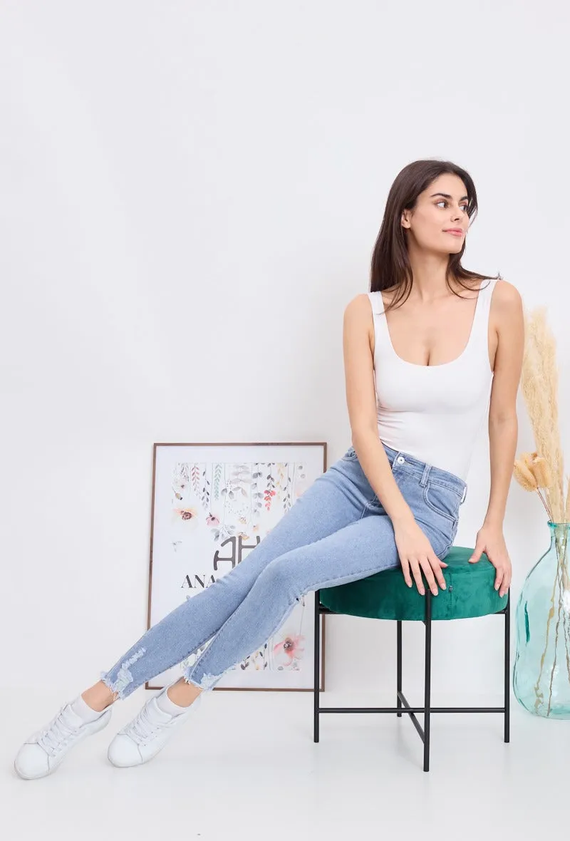 Wholesale Denim Push Up Skinny Jeans With Ripped and Frayed Hem Effect